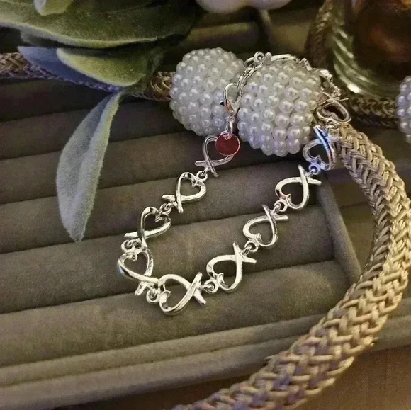 Jewelry - Glamorous, Sterling silver plated, ribbon, heart-shaped bracelet.